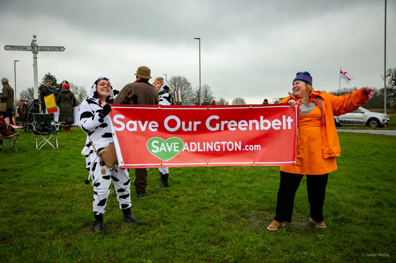 Protesters holding a Stop Adlington New Town banner