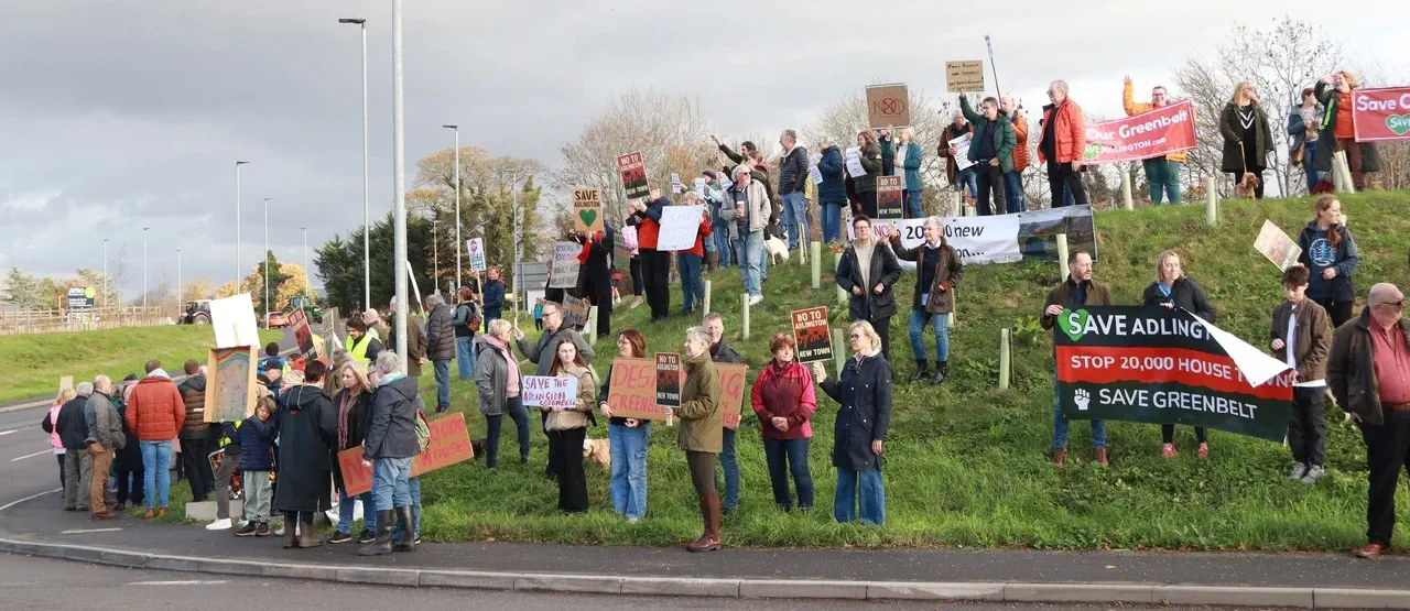 Protesters on roundabout embankment