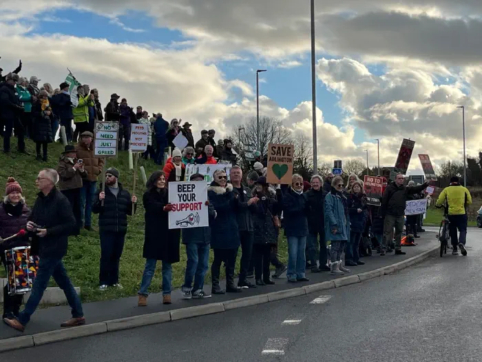 Protesters on side of roundabout