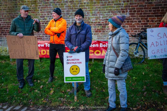 Protesters holding placards
