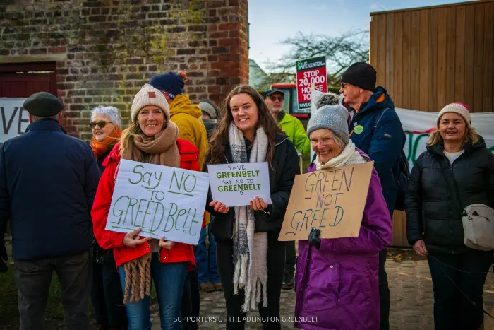 Women holding placards
