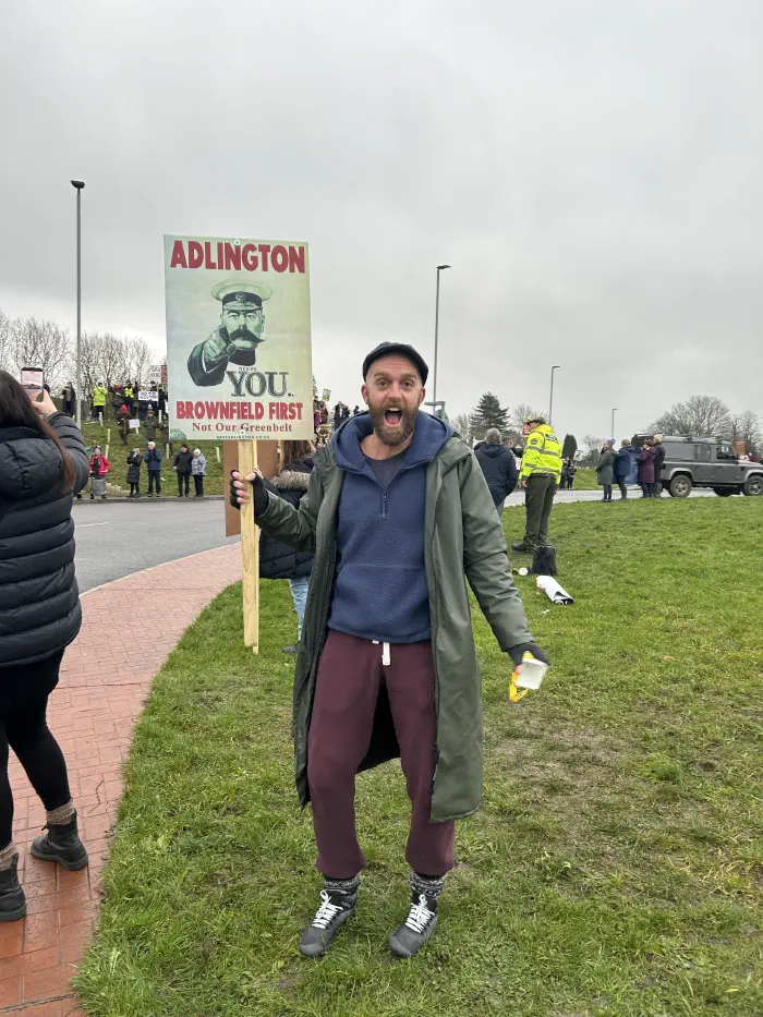 Man with Adlington Needs You placard
