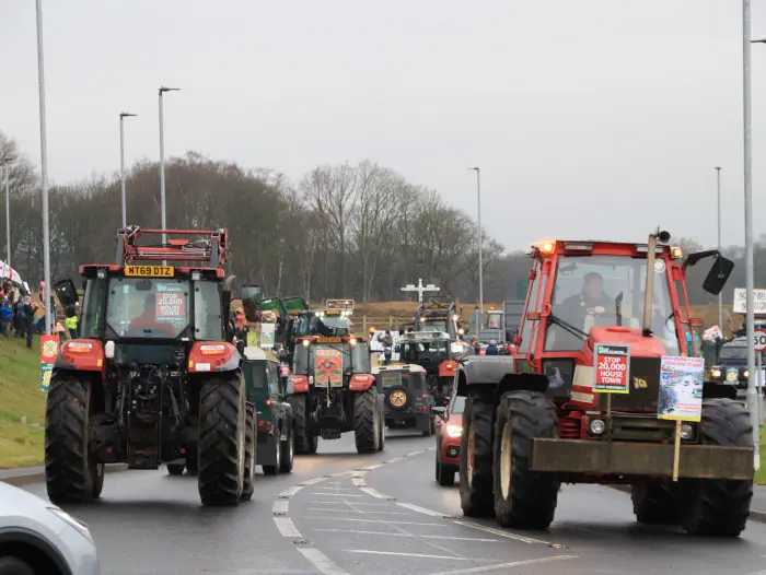 Tractors with placards at Adlington New Town protest