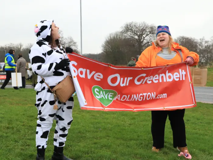 Protesters with banner