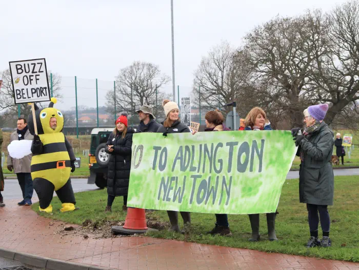Protesters on roundabout with banners