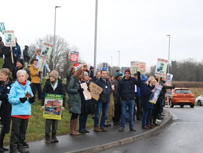 Protesters holding placards at Adlington New Town protest