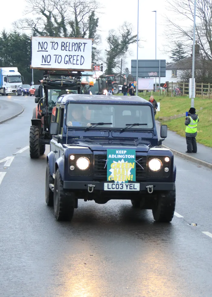 Land Rover with placard at protest for Adlington New Town